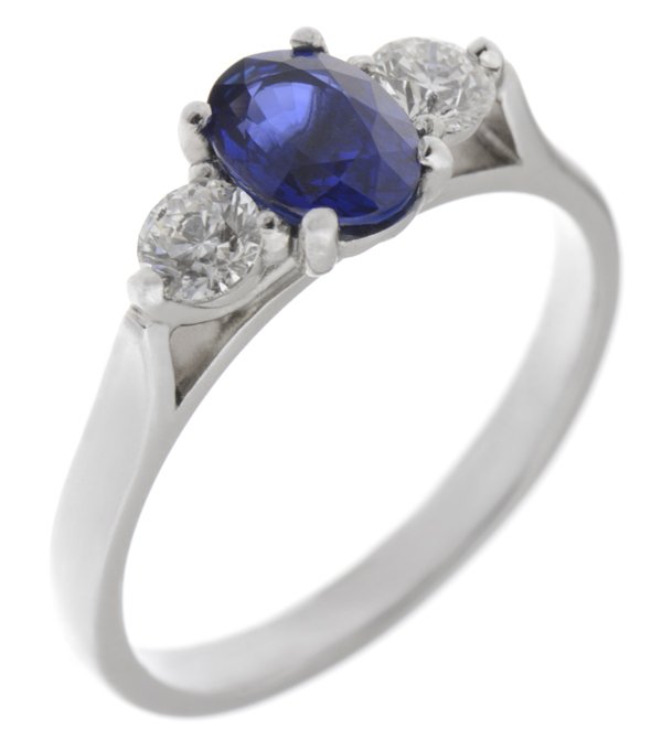 Olivia oval shape blue sapphire and round brilliant cut diamond trilogy ring