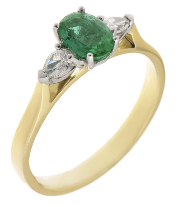 Olivia oval shape emerald and pear cut diamond trilogy ring