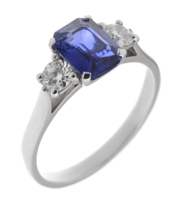 Rosaline emerald cut blue sapphire and round diamond trilogy ring