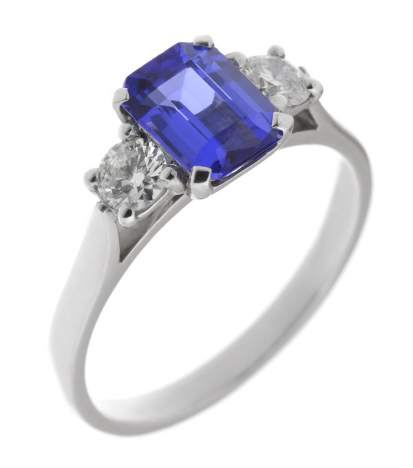 Rosaline emerald cut tanzanite and round diamond trilogy ring