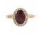 Classic claw set oval shape ruby with round diamond halo ring