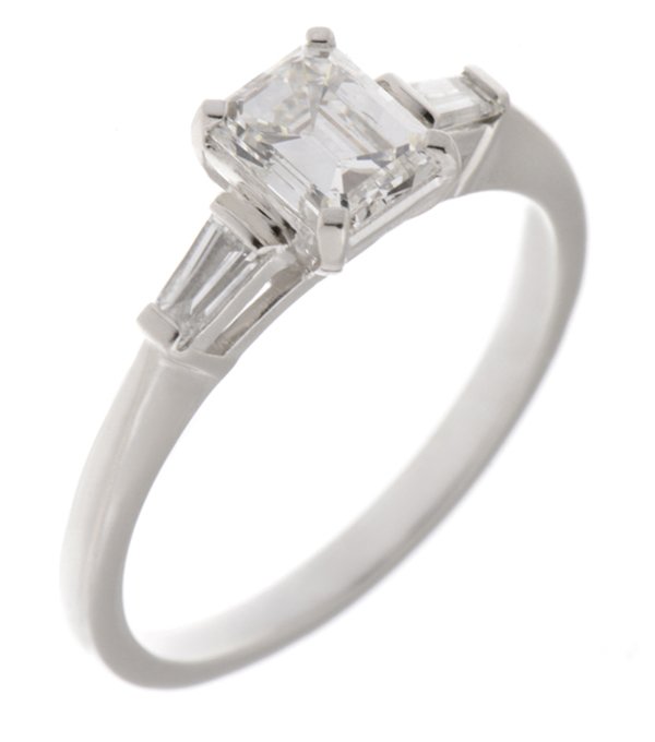 Classic emerald cut diamond engagement ring with baguette shoulders