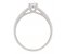 Solitaire round brilliant cut diamond engagement ring with scroll engraved band side