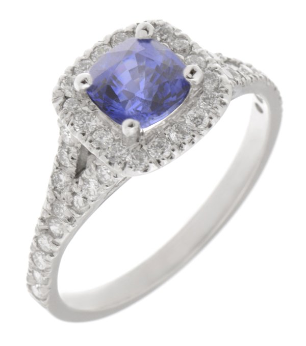 Cushion cut blue sapphire and round diamond halo ring with split shoulders
