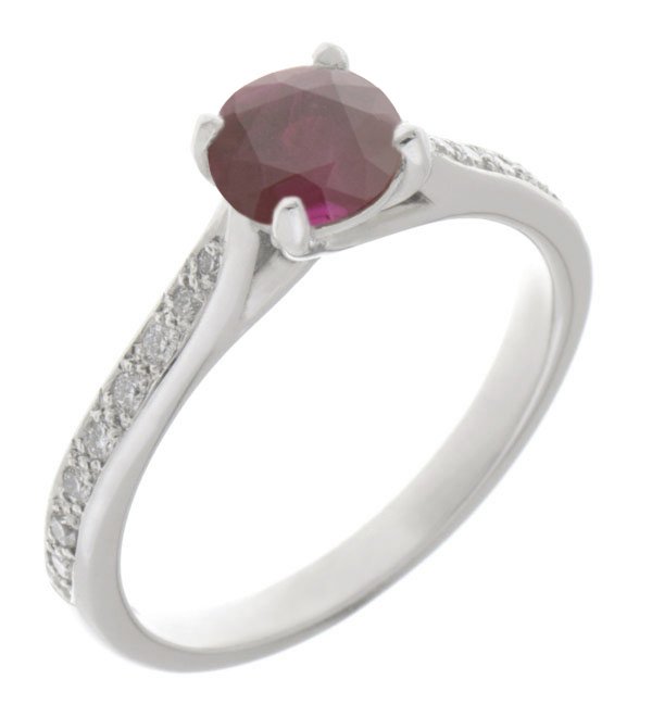 Kiss style round ruby solitaire ring with grain set diamond shoulders
