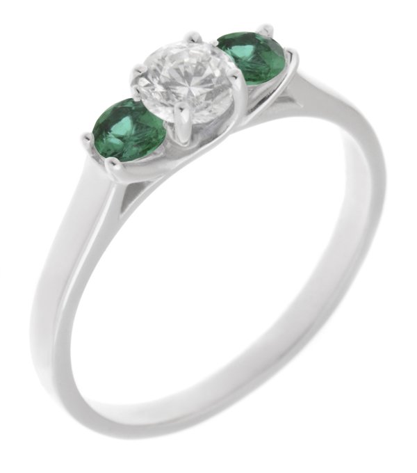 Vienna round brilliant cut diamond and emerald trilogy ring main image