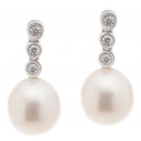 Oval cultured river pearl and diamond trilogy drop earrings