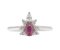 Oval ruby and round and pear shape diamond half cluster ring top view
