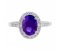 Classic claw set oval tanzanite with round diamond halo ring top view