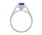 Classic claw set oval tanzanite with round diamond halo ring side view