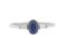 Oval blue sapphire ring with baguette diamond set shoulders top view