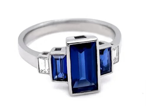 Art deco style baguette cut blue sapphire and diamond ring angle view